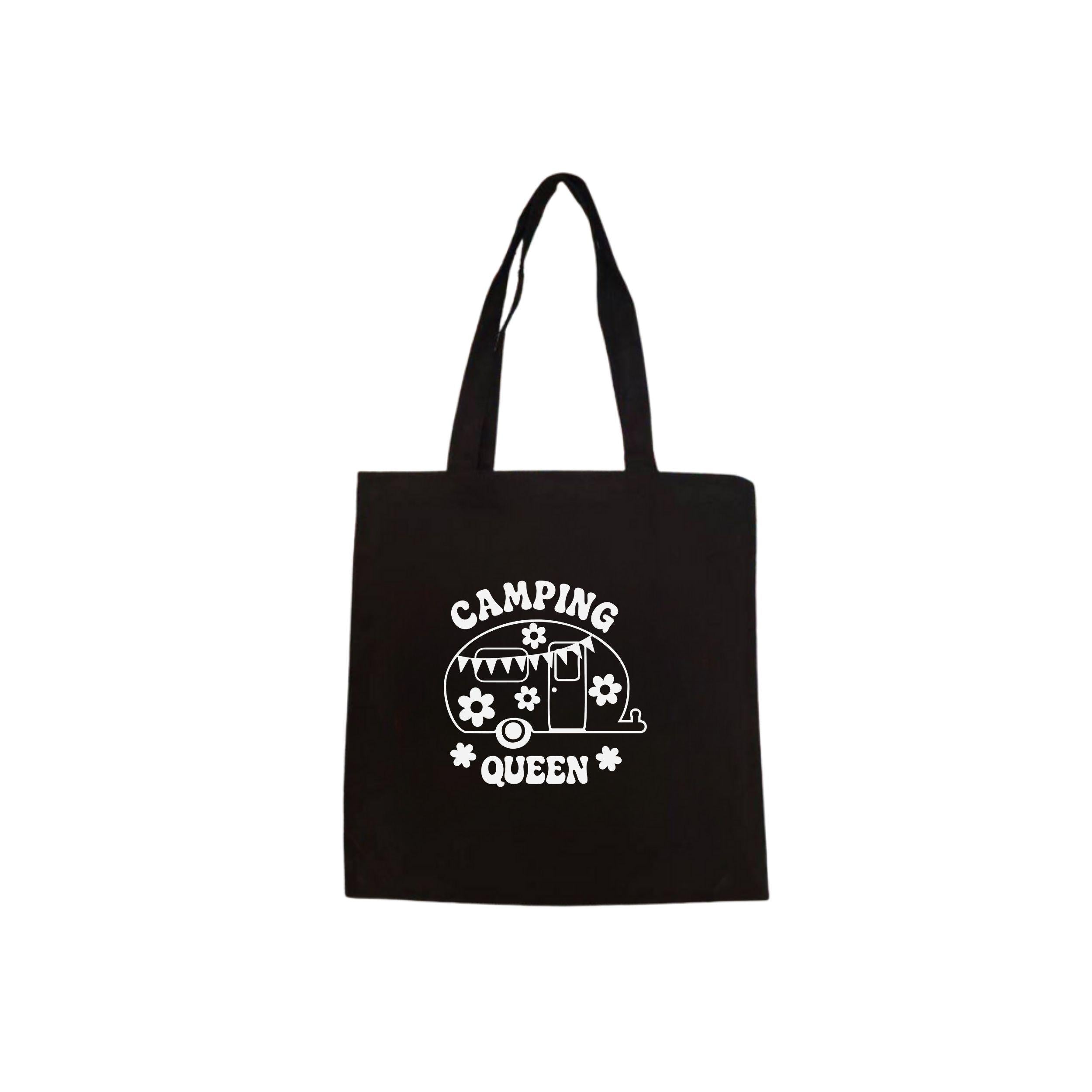 Zwart canvas tote bag met witte camping caravan illustratie en de tekst ‘Camping Queen’.